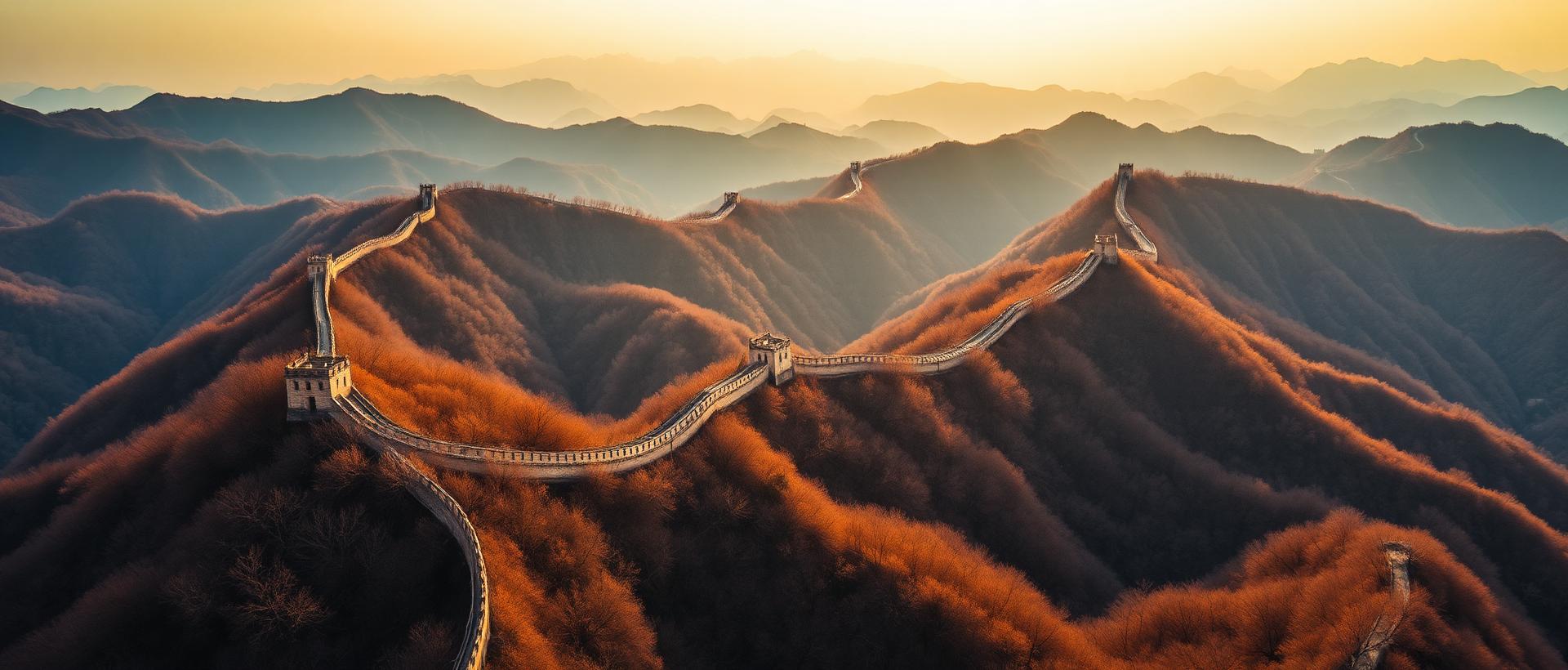Aerial panoramic view of the Great Wall of China snaking across forested mountain ridges at golden hour with dramatic perspective and autumn colors
